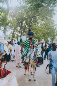 A man in a traditional costume riding a horse